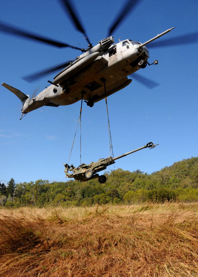 US Navy 090719-N-0120A-634 An MH-53E Sea Stallion helicopter, assigned to the Air Combat Element of the 31st Marine Expeditionary Unit, embarked aboard the forward-deployed amphibious assault ship USS Essex (LHD 2) lifts an M77