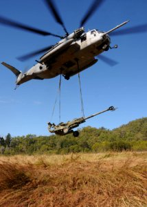 US Navy 090719-N-0120A-634 An MH-53E Sea Stallion helicopter, assigned to the Air Combat Element of the 31st Marine Expeditionary Unit, embarked aboard the forward-deployed amphibious assault ship USS Essex (LHD 2) lifts an M77