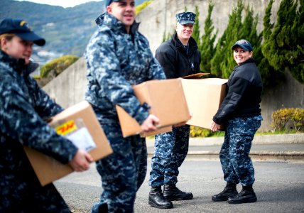 USS Bonhomme Richard (LHD 6) Sailors participate in a Food Drive 170123-N-WF272-020