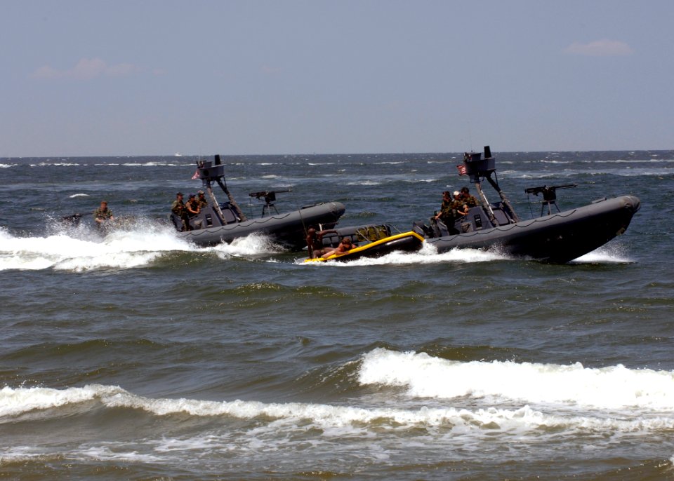 US Navy 090718-N-8949D-155 Navy SEALs are extracted from the waters of the Chesapeake Bay into a sling boat being pulled by a rigid hull inflatable boat (RHIB) during a capabilities demonstration at Naval Amphibious Base Little