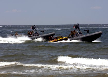 US Navy 090718-N-8949D-155 Navy SEALs are extracted from the waters of the Chesapeake Bay into a sling boat being pulled by a rigid hull inflatable boat (RHIB) during a capabilities demonstration at Naval Amphibious Base Little