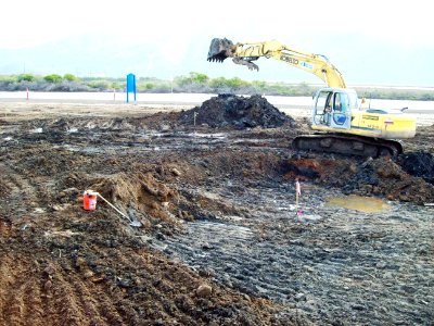 US Navy 090717-N-6865V-001 An excavator removes hazardous waste from an old landfill during a restoration project at Naval Base Ventura County, Point Mugu