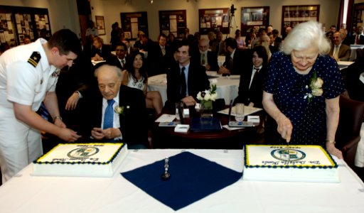 US Navy 090721-N-7676W-101 Dr. Jerome Karle, left, and Dr. Isabella Karle cut their respective cakes as they retire from the Naval Research Laboratory after a combined 127 years of government service