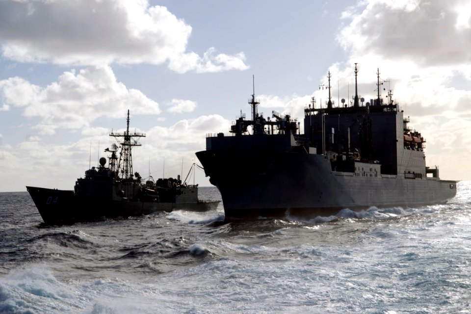 US Navy 090718-N-9123L-188 Royal Australian Navy guided-missile frigate HMAS Darwin (FFG 04) conducts an underway replenishment with the Military Sealift Command dry cargo-ammunition ship USNS Amelia Earhart (T-AKE 6)