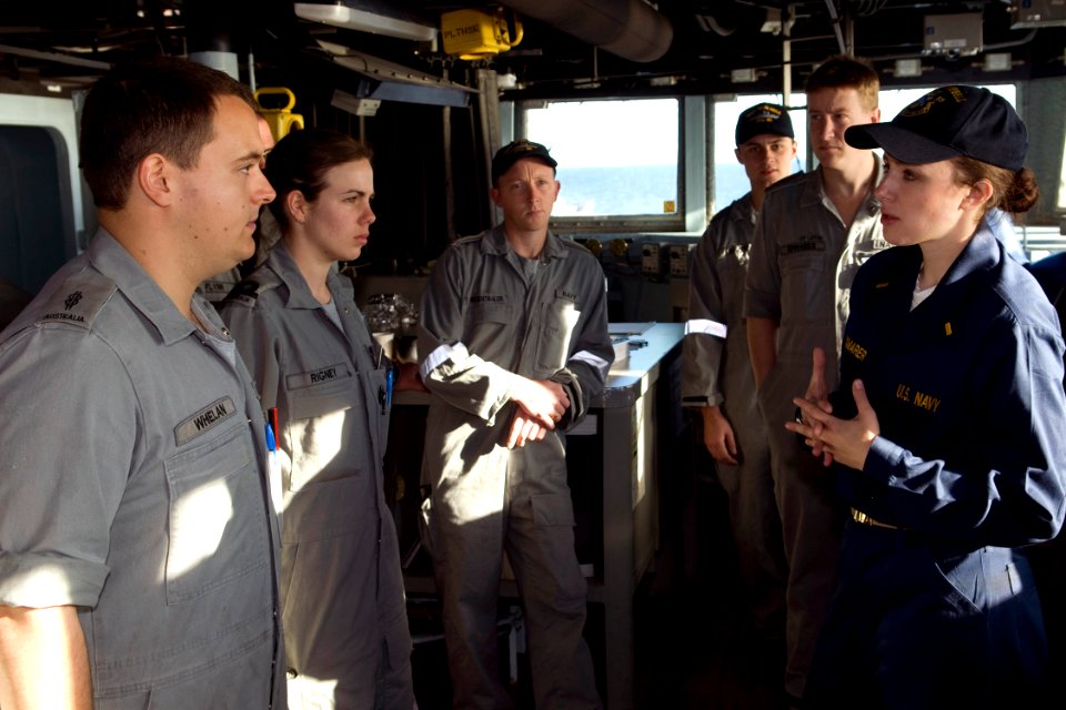 US Navy 090720-N-9123L-027 Ensign Colleen Praxmarer, the strike officer aboard the guided-missile destroyer USS McCampbell (DDG 85) answers questions on the bridge from sailors assigned to the Royal Australian Navy guided-missi
