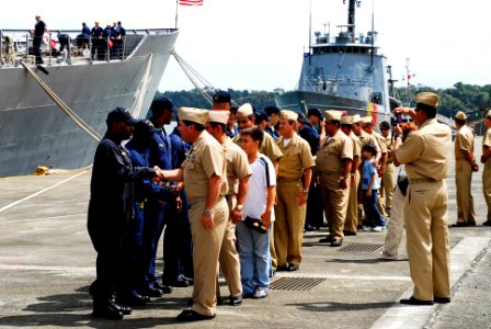 US Navy 090719-N-7092S-353 Colombian Navy sailors and family members meet and greet Sailors assigned to the guided-missile frigate USS Kauffman (FFG 59) shortly after arriving in Bahia Malaga, Colombia
