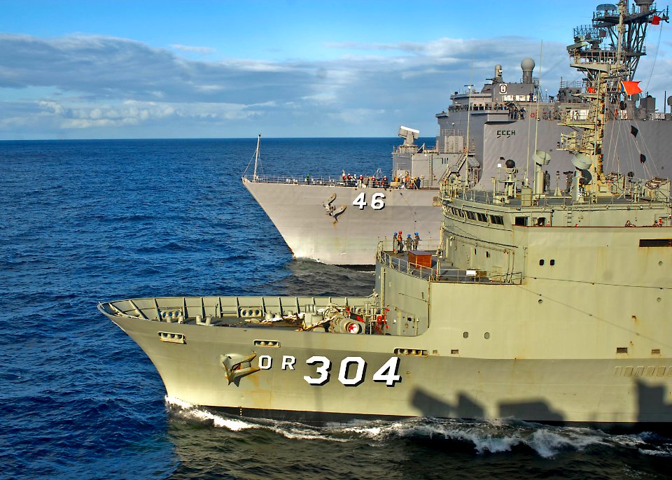 US Navy 090718-N-9950J-005 The Australian underway replenishment tanker HMAS Success (OR 304) and the dock landing ship USS Tortuga (LSD 46) steam alongside the forward-deployed amphibious assault ship USS Essex
