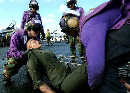 US Navy 090722-N-1062H-019 ailors recover a simulated casualty aboard the aircraft carrier USS George Washington (CVN 73)