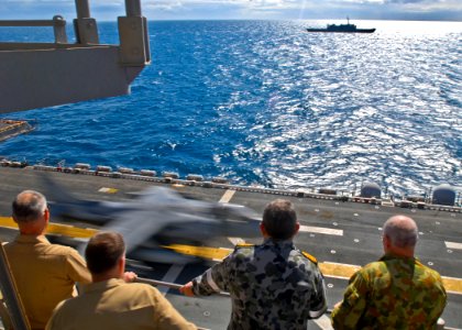 US Navy 090720-N-9950J-106 Senior personnel observe the launch of an AV-8B Harrier aircraft aboard Essex during exercise Talisman Saber 2009