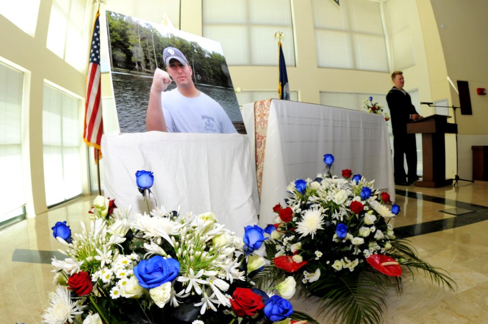 US Navy 090720-N-5821P-013 Explosive Ordnance Disposal Technician 1st Class William Greathouse, assigned to Explosive Ordnance Disposal Mobile Unit (EODMU) 8, speaks during a memorial service at Naval Air Station Sigonella