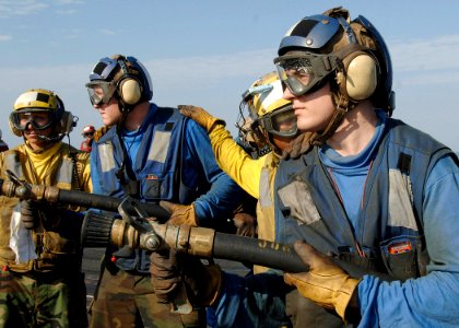 US Navy 090721-N-2013O-016 Sailors fight a simulated flight deck fire during a general quarters drill aboard the aircraft carrier USS George Washington (CVN 73)