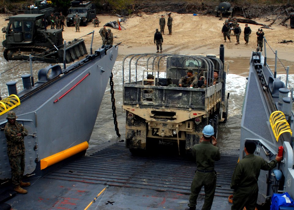 US Navy 090722-N-6692A-037 Sailors guide a truck from the 31st Marine Expeditionary Unit (31st MEU) onto Landing Craft Utility (LCU) 1627 as Marines disembark for the field training part of military exercise Talisman Saber 2009