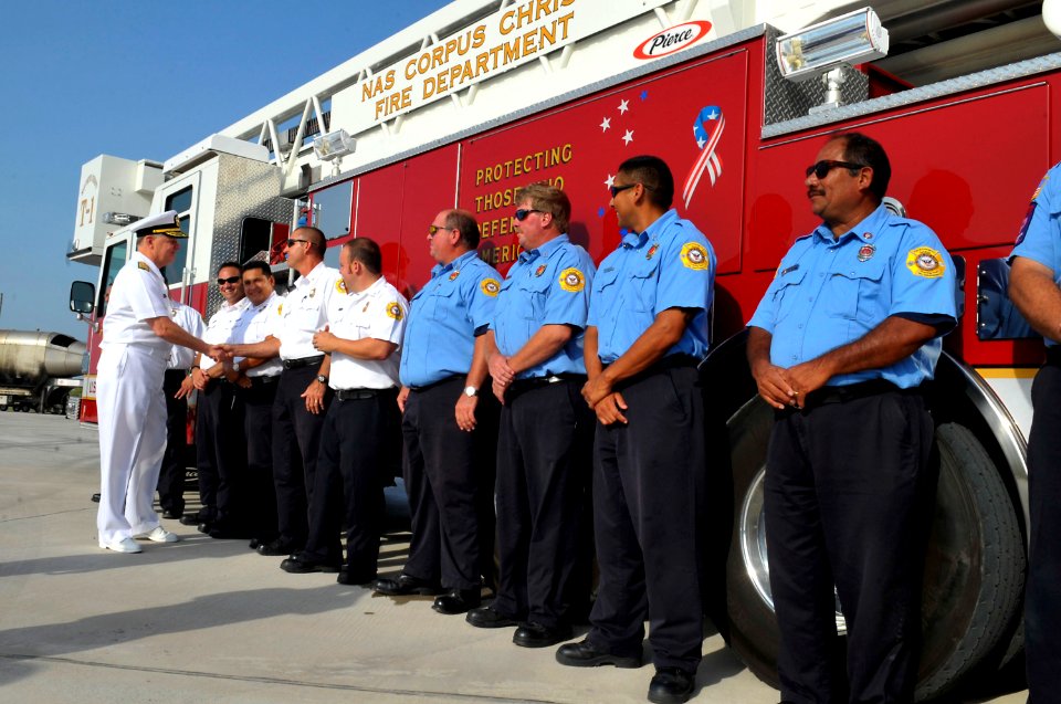 US Navy 090721-N-8273J-271 Chief of Naval Operations (CNO) Adm. Gary Roughead speaks with Navy Civilian fire fighters at the fire training tower while visiting Naval Air Station (NAS) Corpus Christi