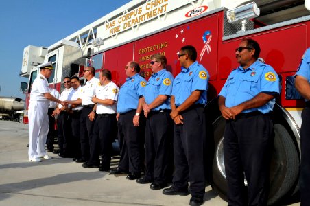 US Navy 090721-N-8273J-271 Chief of Naval Operations (CNO) Adm. Gary Roughead speaks with Navy Civilian fire fighters at the fire training tower while visiting Naval Air Station (NAS) Corpus Christi