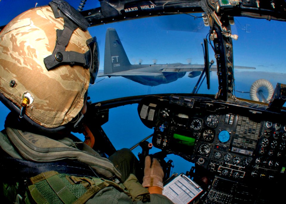 US Navy 090721-N-9950J-236 Marine Capt. Erick Min, assigned to Marine Medium Helicopter Squadron (HMM) 262, pilots a CH-53E Sea Stallion helicopter during an in-flight refueling