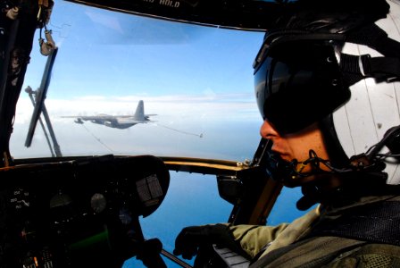 US Navy 090721-N-9950J-508 Marine Capt. Erick Min, assigned to Marine Medium Helicopter Squadron (HMM) 262, pilots a CH-53E Sea Stallion helicopter during an in-flight refueling