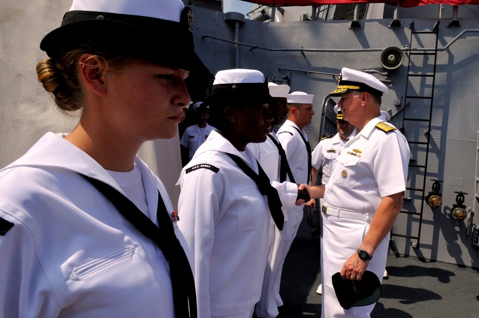US Navy 090724-N-8273J-210 Chief of Naval Operations (CNO) Adm. Gary Roughead greets sailors after being piped aboard the the guided-missile destroyer USS Barry (DDG 52)