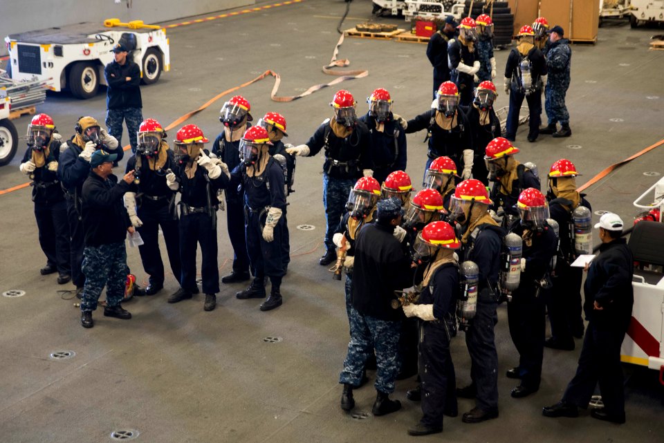 USS Bonhomme Richard (LHD 6) Air Department Sailors Combat Simulated Fire 170224-N-XT039-312