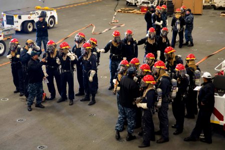 USS Bonhomme Richard (LHD 6) Air Department Sailors Combat Simulated Fire 170224-N-XT039-312