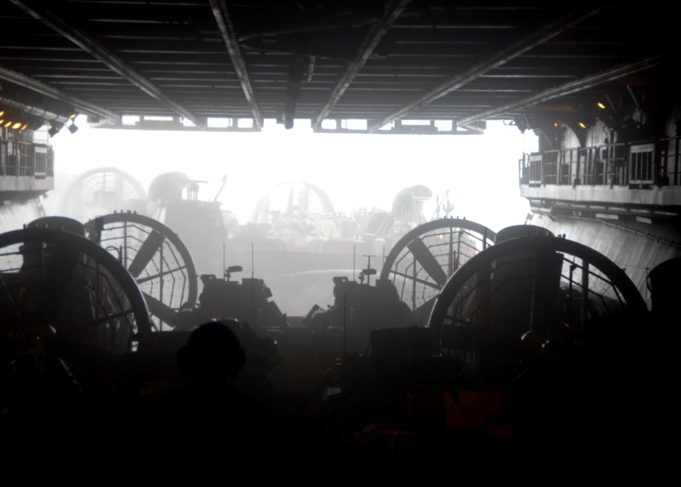 US Navy 090723-N-5148B-031 A Marine from the 11th Marine Expeditionary Unit observes Landing Craft Air Cushion launch from the well deck aboard the USS Bonhomme Richard (LHD 6)