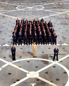 US Navy 090723-N-7090S-103 The first crew of the amphibious transport dock ship USS New York (LPD 21) stands in formation behind Cmdr. F. Curtis Jones, commanding officer, Cmdr. Erich B. Schmidt,