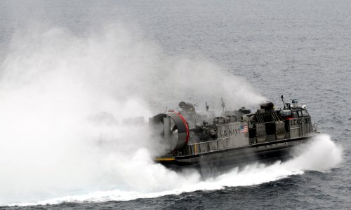 US Navy 090726-N-5148B-123 A landing craft air cushion (LCAC) assigned to Assault Craft Unit (ACU) 5 debarks the well deck of the amphibious dock landing ship USS Rushmore (LSD 47)