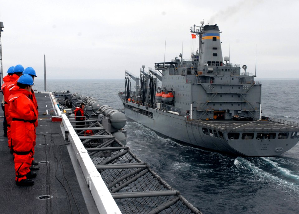 US Navy 090724-N-2600H-006 Sailors assigned to the deck department of the aircraft carrier USS Nimitz (CVN 68) stand on the flight deck as it approaches the Military Sealift Command fleet replenishment oiler USNS Yukon (T-AO 20