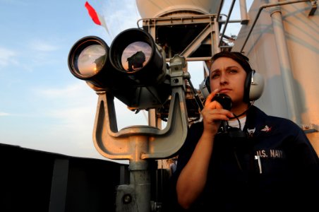 US Navy 090724-N-7456N-048 Operations Specialist 3rd Class Krystal Ramos, assigned to the operations department of the aircraft carrier USS Carl Vinson (CVN 70), stands port-aft lookout watch for surface and air contacts