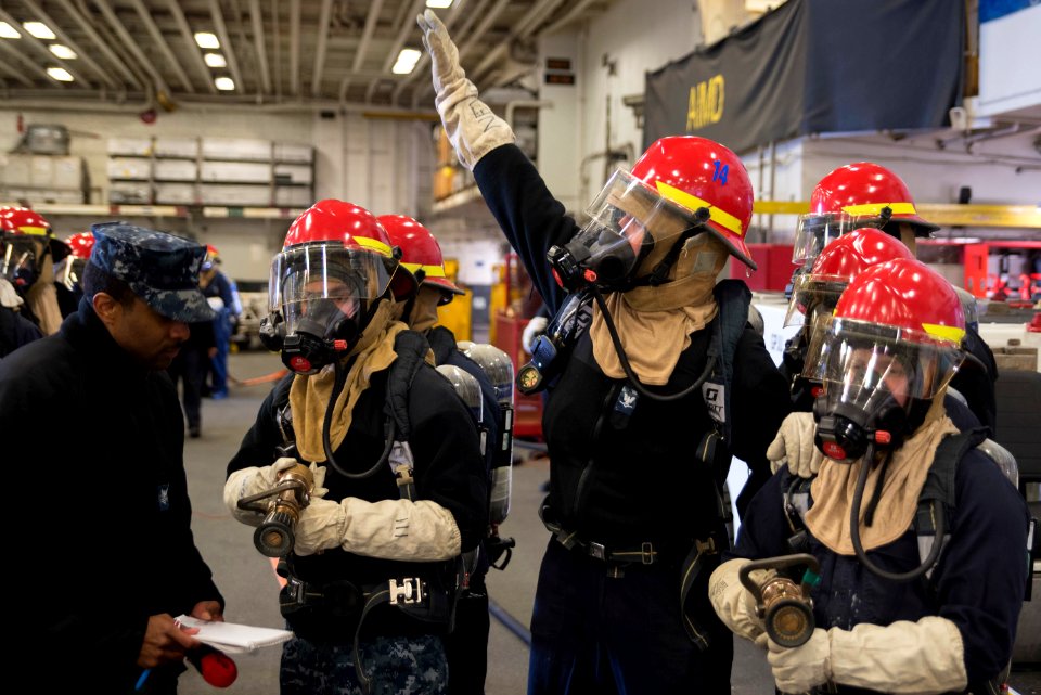 USS Bonhomme Richard (LHD 6) Air Department Sailors Combat Simulated Fire 170224-N-XT039-342