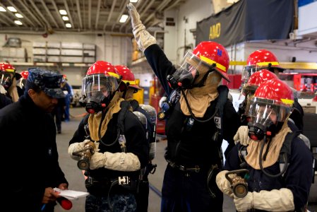 USS Bonhomme Richard (LHD 6) Air Department Sailors Combat Simulated Fire 170224-N-XT039-342