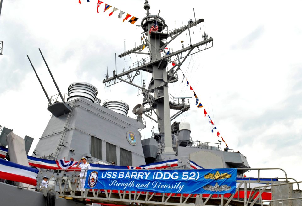 US Navy 090724-N-8273J-247 Chief of Naval Operations (CNO) Adm. Gary Roughead departs the guided-missile destroyer USS Barry (DDG 52) after visiting the commanding officer and crew