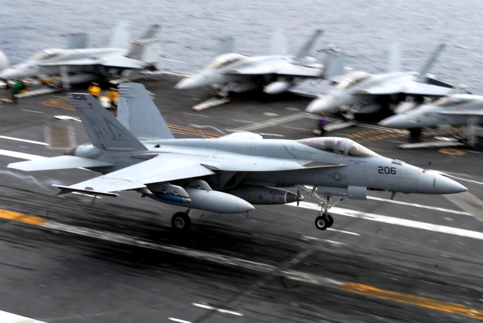 US Navy 090727-N-2918M-040 An F-A-18F Super Hornet assigned to the Tophatters of Strike Fighter Squadron (VFA) 14 makes an arrested landing during flight operations aboard the aircraft carrier USS Nimitz(CVN 68)