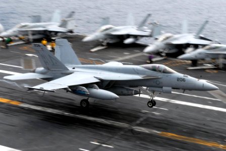 US Navy 090727-N-2918M-040 An F-A-18F Super Hornet assigned to the Tophatters of Strike Fighter Squadron (VFA) 14 makes an arrested landing during flight operations aboard the aircraft carrier USS Nimitz(CVN 68)