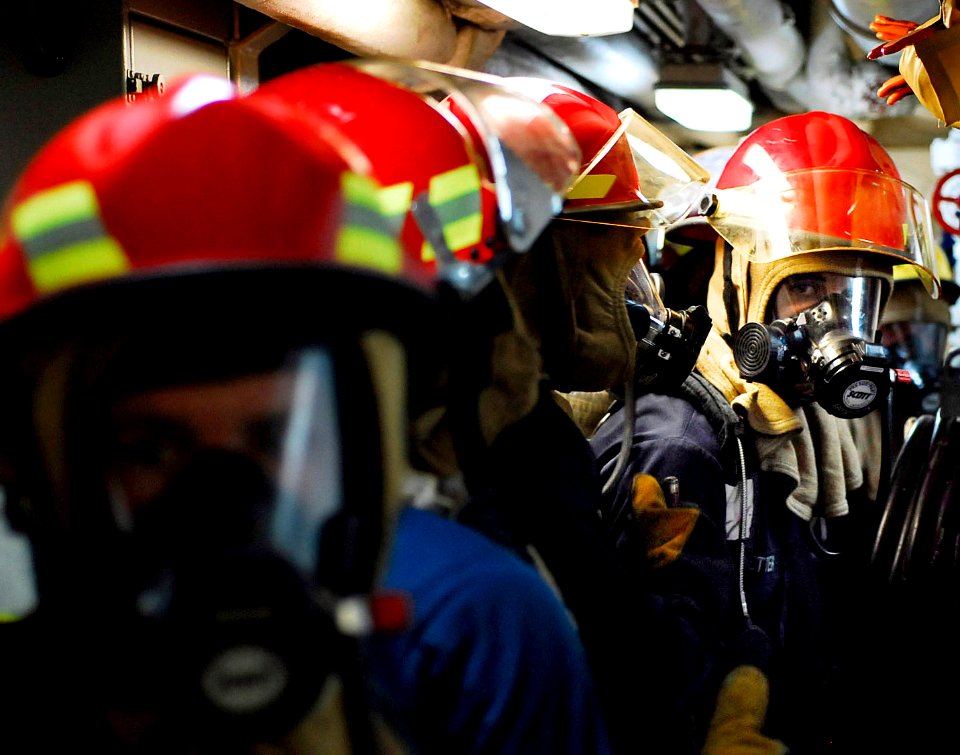 US Navy 090727-N-7092S-444 Sailors assigned to the guided-missile frigate USS Kauffman (FFG 59) prepare to enter the main engine room during a fire drill