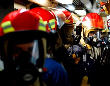 US Navy 090727-N-7092S-444 Sailors assigned to the guided-missile frigate USS Kauffman (FFG 59) prepare to enter the main engine room during a fire drill