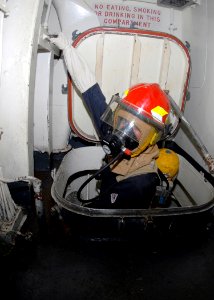 US Navy 090727-N-5148B-018 A Sailor aboard the amphibious dock landing ship USS Rushmore (LSD 47) participates in a general quarters drill