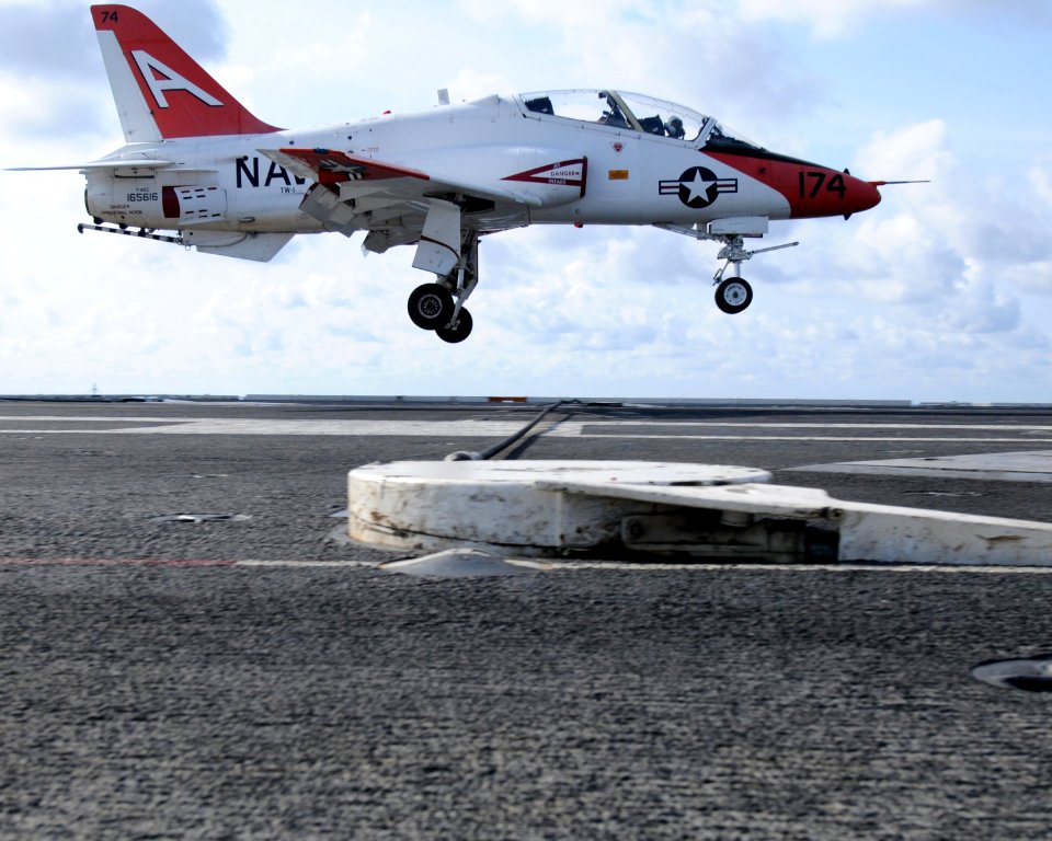 US Navy 090729-N-6006S-102 A T-45 Goshawk training aircraft practices carrier approach touch-and-goes aboard the aircraft carrier USS Carl Vinson (CVN 70)