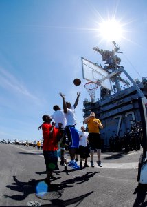 US Navy 090727-N-6720T-047 Sailors play basketball during a steel beach cook out on the flight deck of the aircraft carrier USS George Washington (CVN 73)