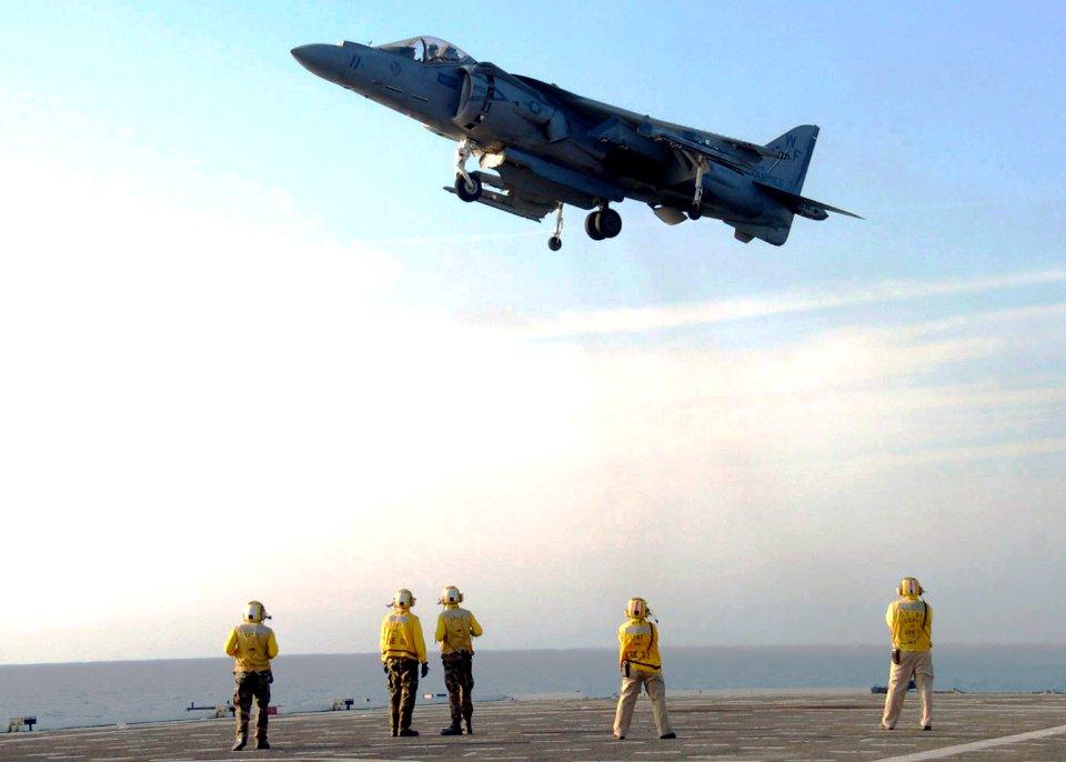 US Navy 090726-N-3925A-001 An AV-8-B Harrier assigned to the Sea Elks of Marine Medium Helicopter Squadron (HMM) 166 lands aboard the amphibious transport dock ship USS Cleveland (LPD 7)