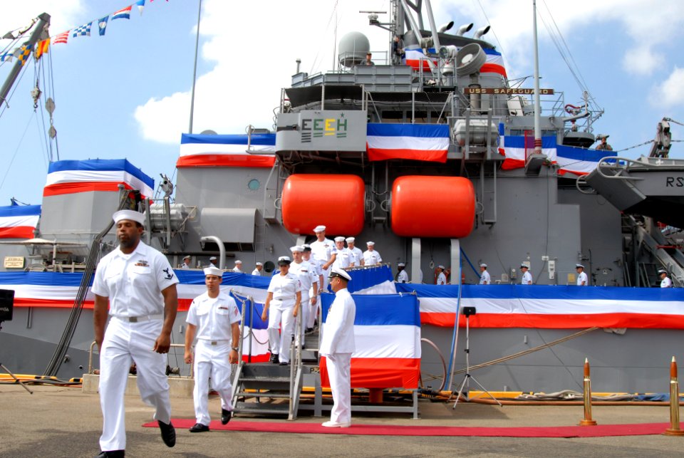 US Navy 090726-N-4124C-058 Sailors of the former rescue and salvage ship USS Safeguard (ARS 50) depart as the ship's decommissioning flag is lowered to officially transfer the ship to the Military Sealift Command