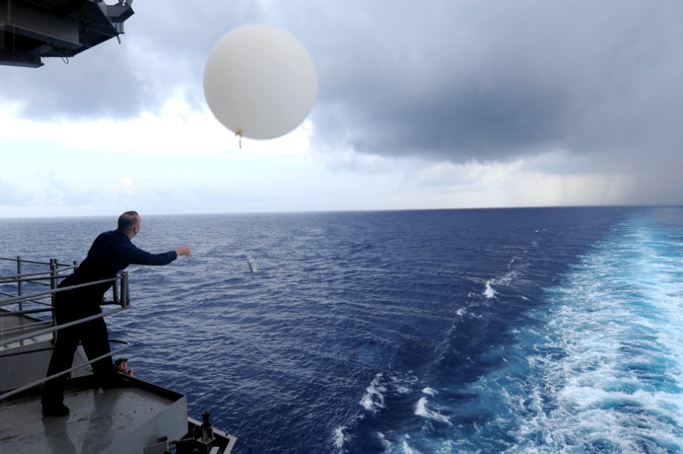 US Navy 090728-N-4275C-098 Aerographer's Mate 1st Class Jim Neurohr releases a weather balloon off of the aft end of the aircraft carrier USS Carl Vinson (CVN 70). The balloon is used to take atmospheric readings