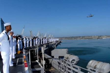 US Navy 090731-N-1786N-058 ailors aboard the aircraft carrier USS Nimitz (CVN 68) stand at parade rest while they man the rails