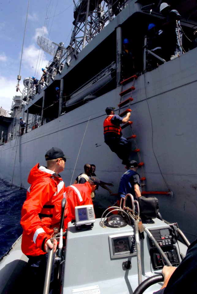 US Navy 090728-N-7092S-065 U.S. Coast Guard personnel board the guided-missile frigate USS Kauffman (FFG 59) for a luncheon