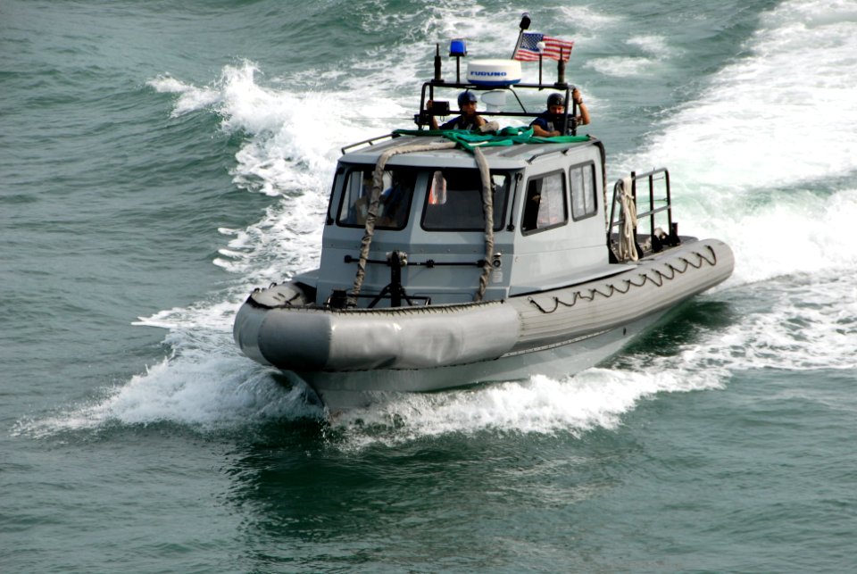 US Navy 090727-A-1839I-051 A rigid hull inflatable boat assigned to the amphibious dock landing ship USS Oak Hill (LSD 51) returns from Brazilian Naval Landing Craft Unit 11 after transporting U.S. Marines