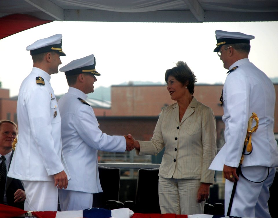US Navy 090731-N-3090M-469 Former first lady and ship's sponsor Laura Bush congratulates Cmdr. James Gray on a successful command tour the Virginia-class attack submarine USS Texas (SSN 775)