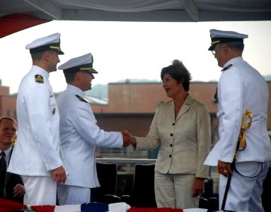 US Navy 090731-N-3090M-469 Former first lady and ship's sponsor Laura Bush congratulates Cmdr. James Gray on a successful command tour the Virginia-class attack submarine USS Texas (SSN 775)