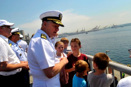 US Navy 090729-N-8273J-074 Chief of Naval Operations (CNO) Adm. Gary Roughead speaks with children about the Navy ships passing by during the Seattle Seafair parade of ships