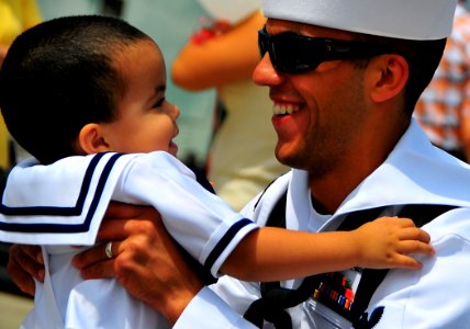 US Navy 090730-N-4774B-074 Gas Turbine Systems Technician Mechanical 2nd Class Jonathan Mackey reunites with his son during the homecoming of the guided-missile cruiser USS Lake Champlain (CG 57)