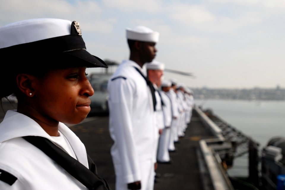 US Navy 090731-N-2918M-068 Aviation Boatswain's Mate (Fuel) Seaman Kyesha Alexander, from Houston, mans the rails as the aircraft carrier USS Nimitz (CVN 68) and embarked Carrier Air Wing (CVW) 11 depart San Diego