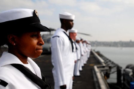 US Navy 090731-N-2918M-068 Aviation Boatswain's Mate (Fuel) Seaman Kyesha Alexander, from Houston, mans the rails as the aircraft carrier USS Nimitz (CVN 68) and embarked Carrier Air Wing (CVW) 11 depart San Diego